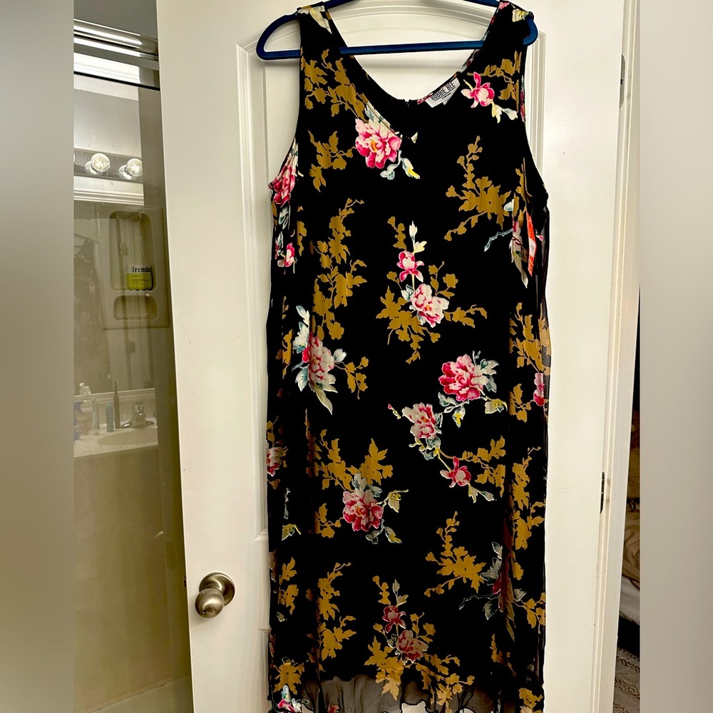 Beautiful vintage dress never worn tag still on it.